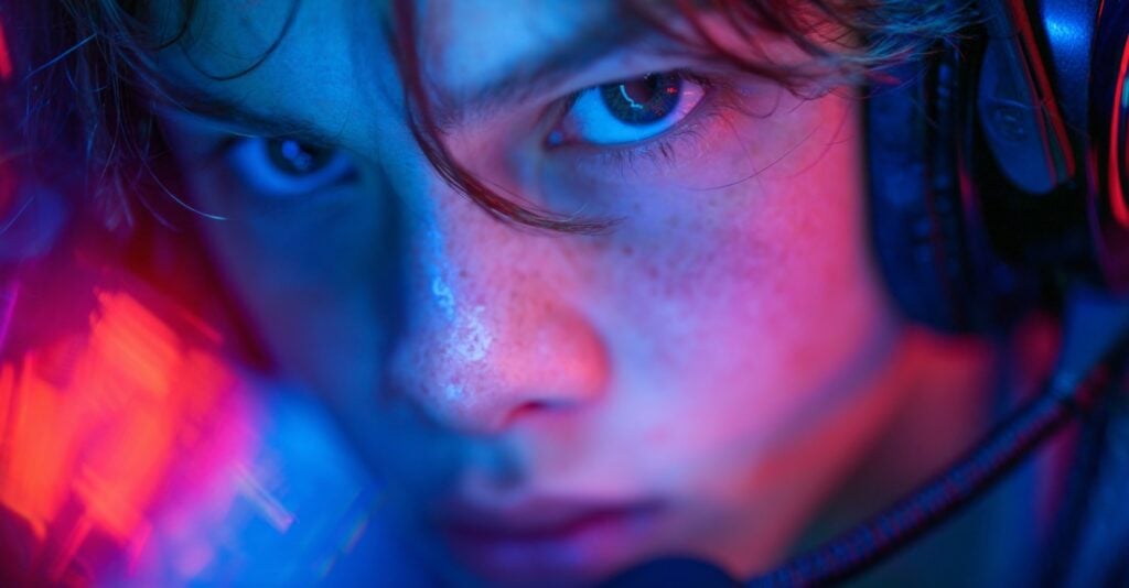 Teen immersed in futuristic educational video game