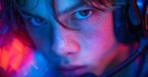 Teen immersed in futuristic educational video game
